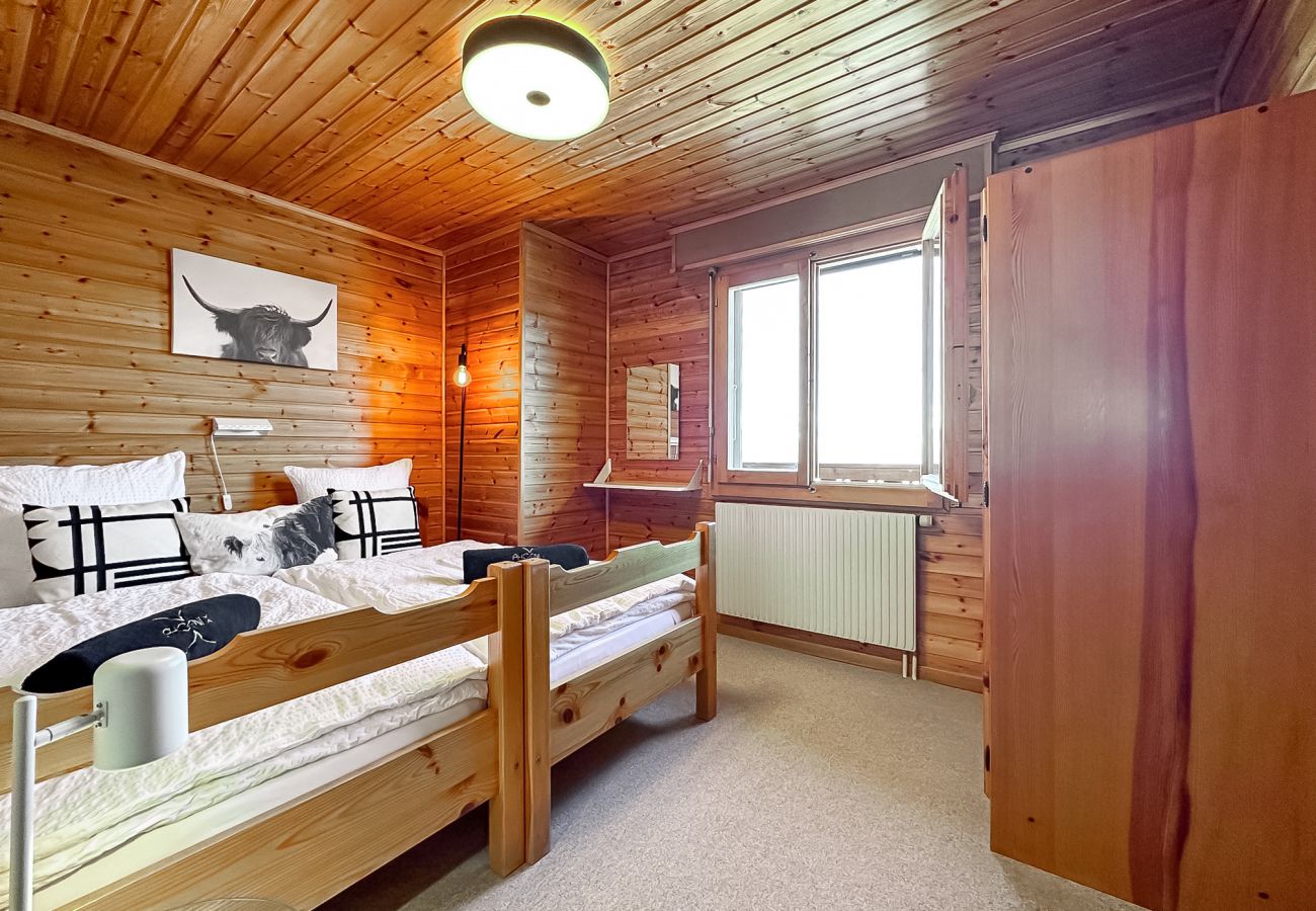 Spacious room with a large comfortable bed and a window that lights up the room