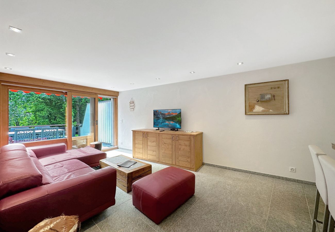Living room with television and sofa 