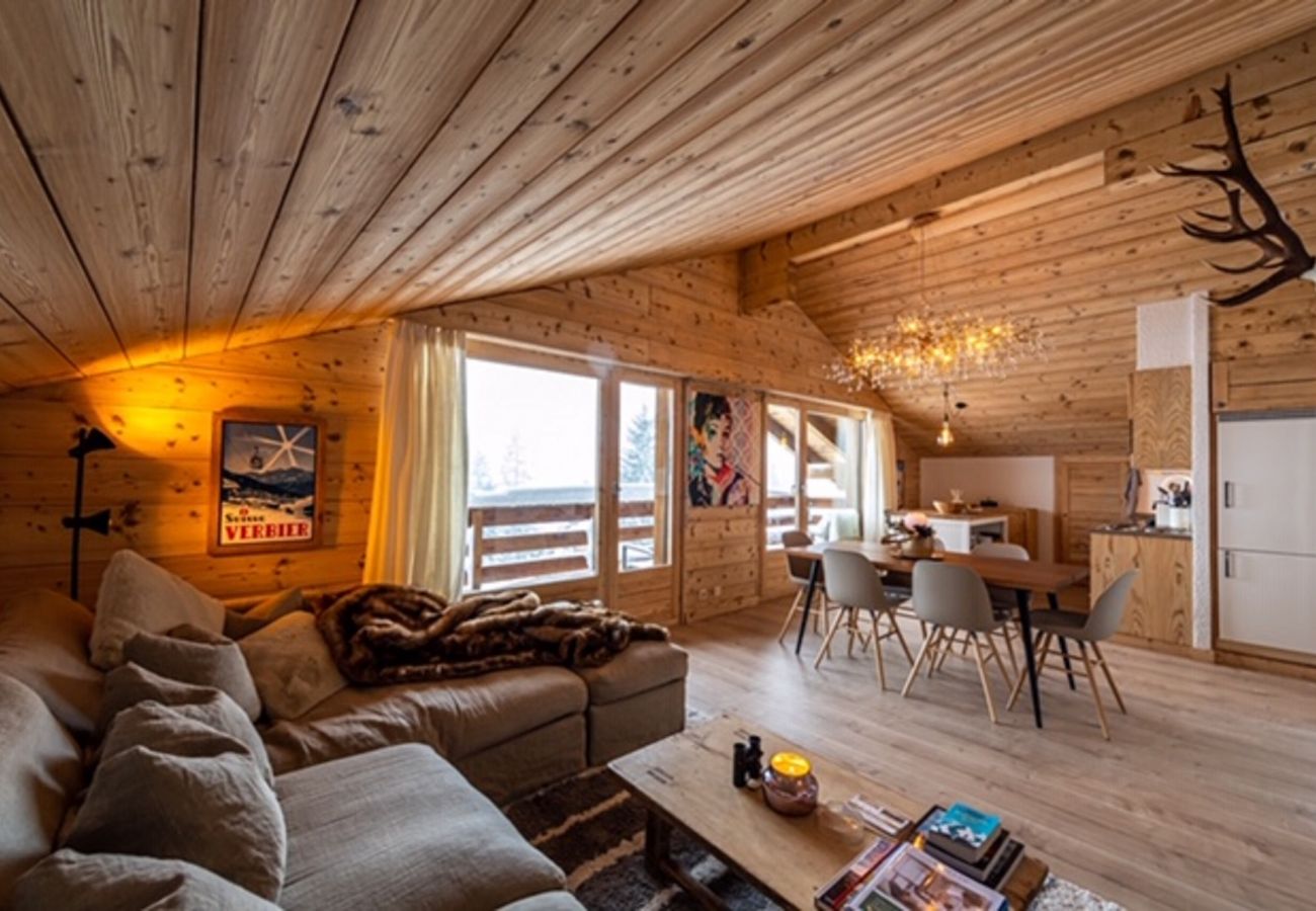 Salon cosy d'une propriété skis aux pieds dans le domaine de Verbier 4vallées